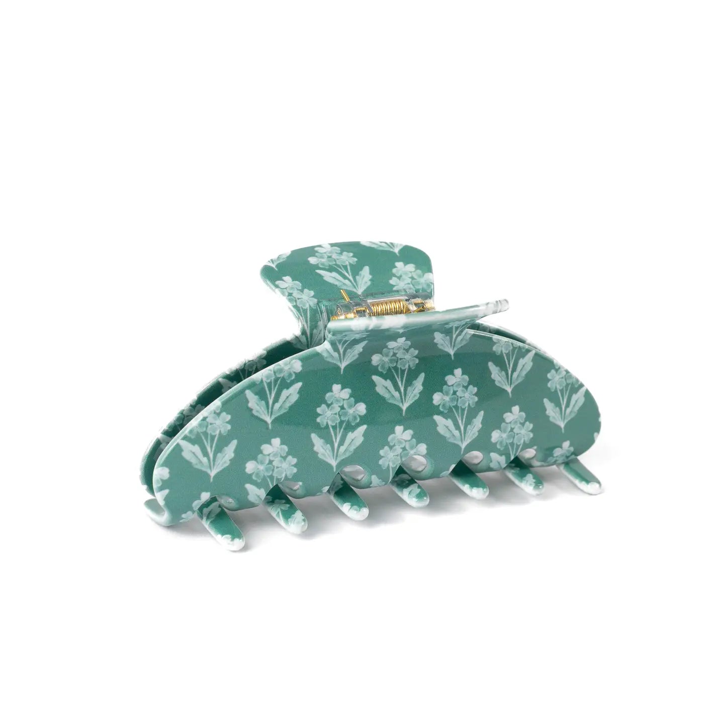 green claw clip with white floral pattern