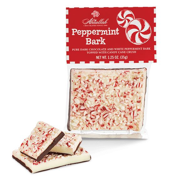 A package of Abdallah Peppermint Bark candy with a visible window showing the white peppermint candy with chocolate and candy pieces. The packaging is predominantly red and white with a spiral design and text.