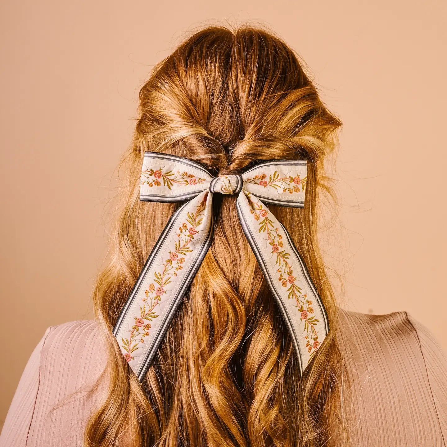 back view of person's head wearing cream Cottage Crush Hair Bow