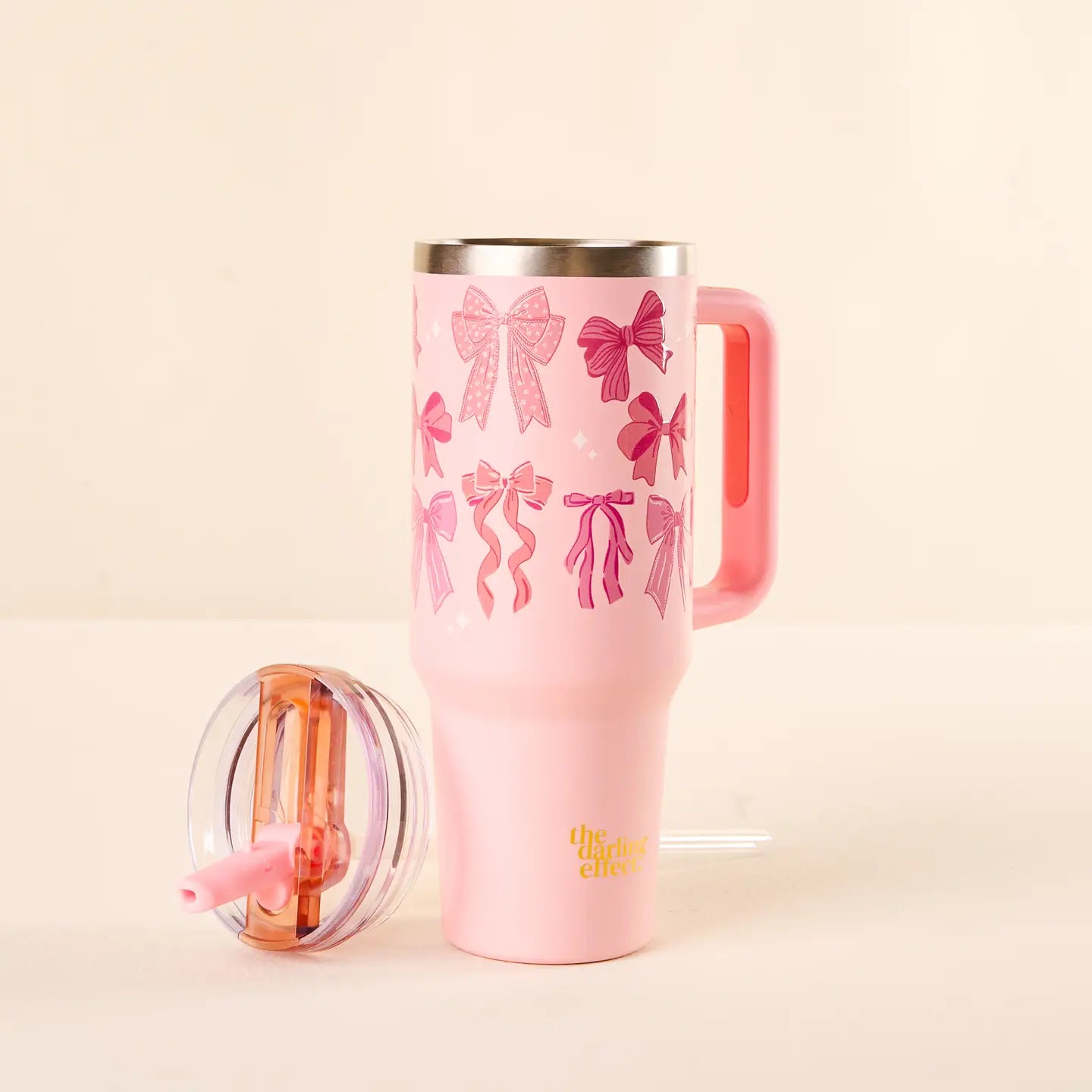 blushing bows 40 ounce tumbler set next to its flip straw lid