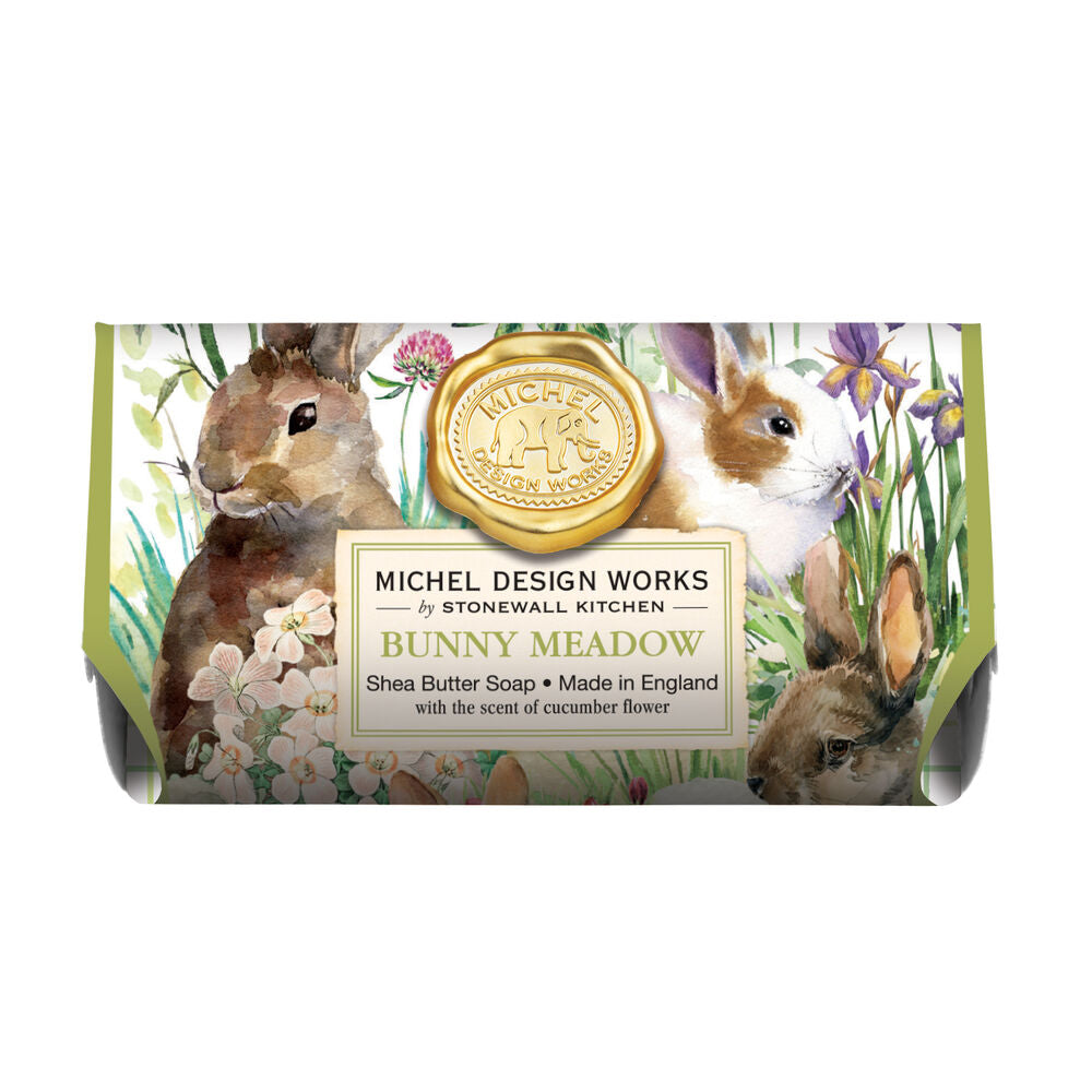 Bunny Meadow Shea Butter Bath Soap Bar wrapped in paper printed with bunnies among wildflowers.