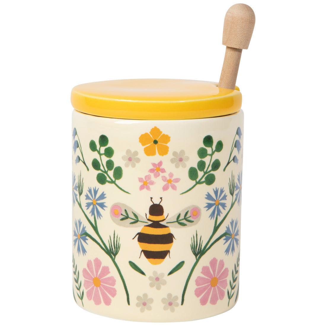 honey pot with flower design with a yellow lid and honey dipper inside
