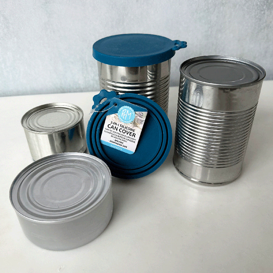 silicone can covers on top of metal cans with a white background