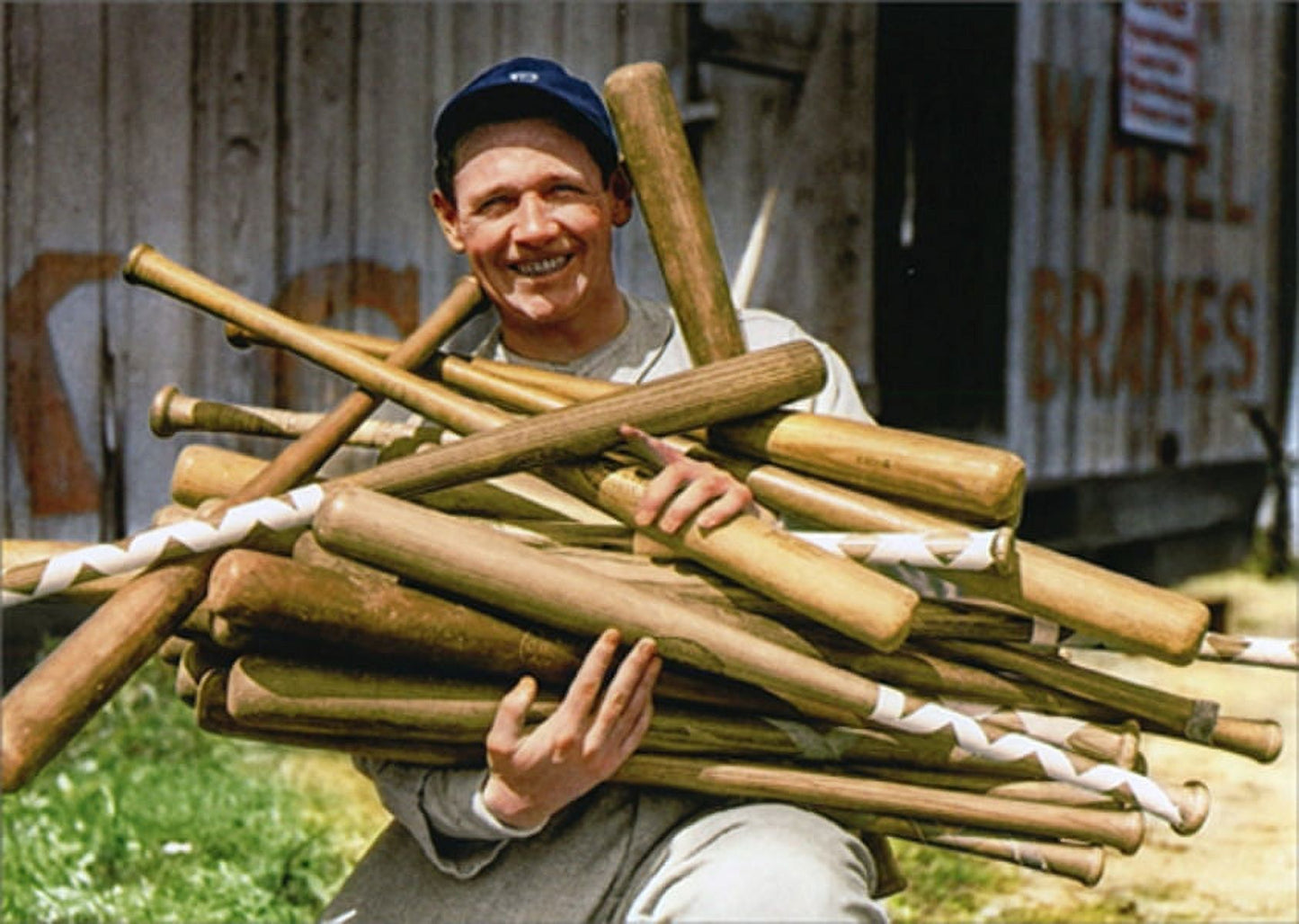 front of card is harry heilmann holding twenty baseball bats