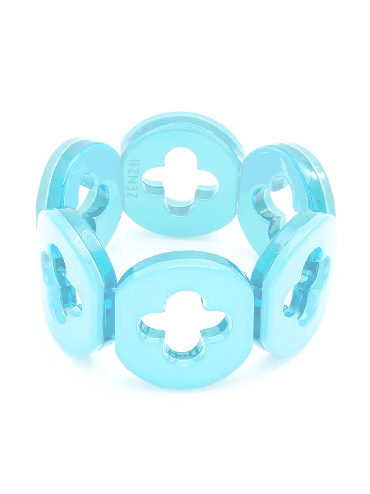 A light blue, resin clover bracelet with a series of connected circular beads.