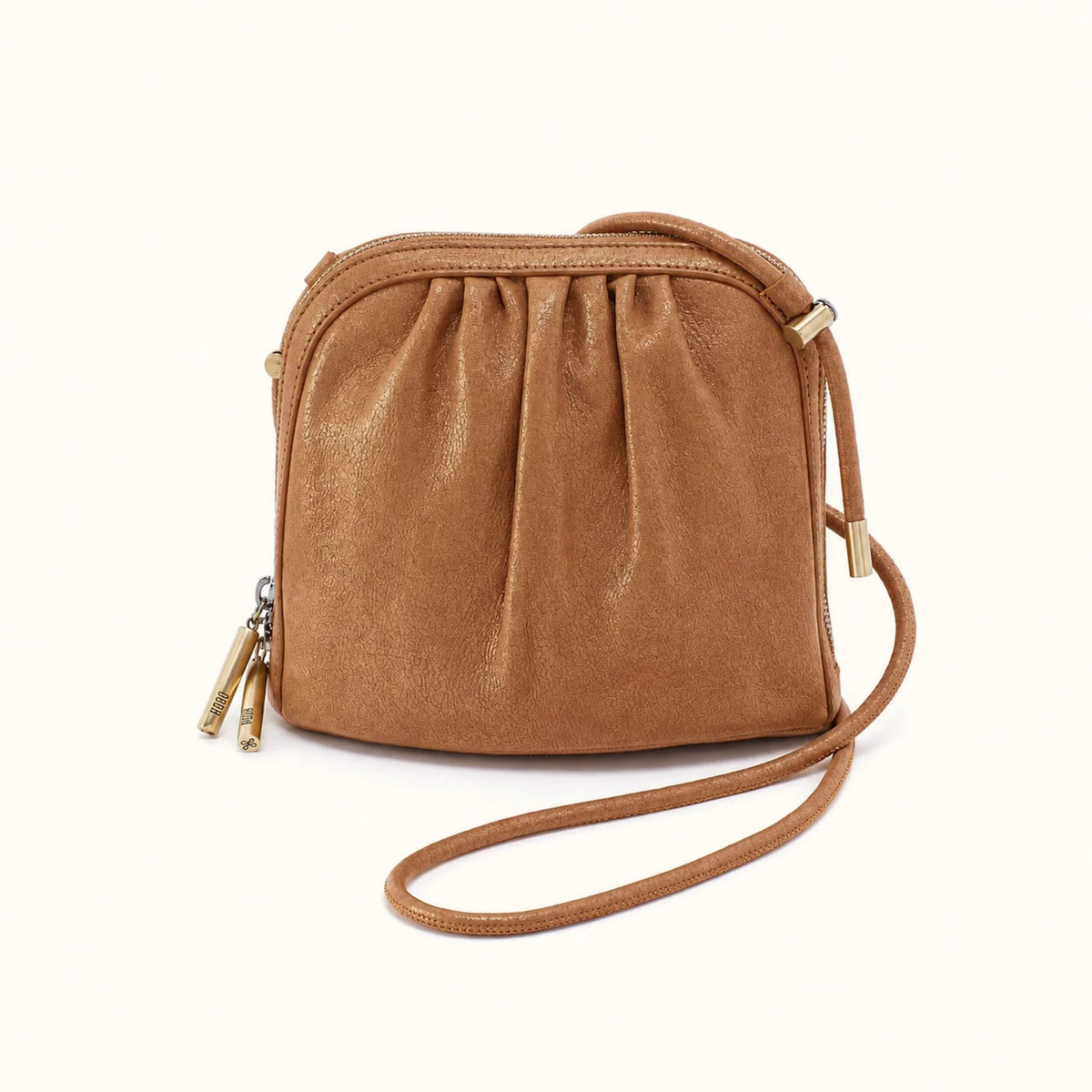 Isabella crossbody in honey gold on a white background