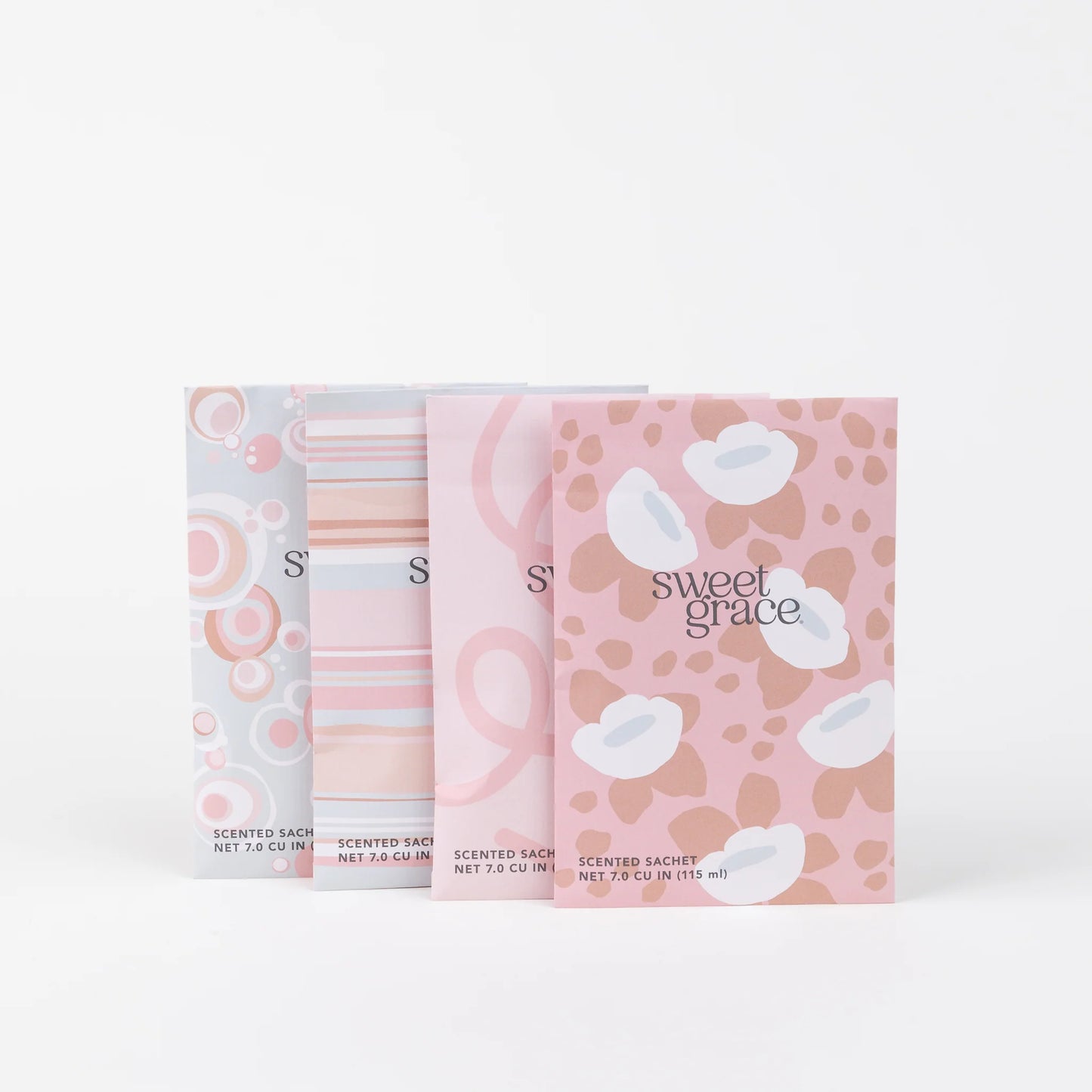 assorted Sweet Grace Scented Sachet with modern floral design of pinks, white, and greys on a white background