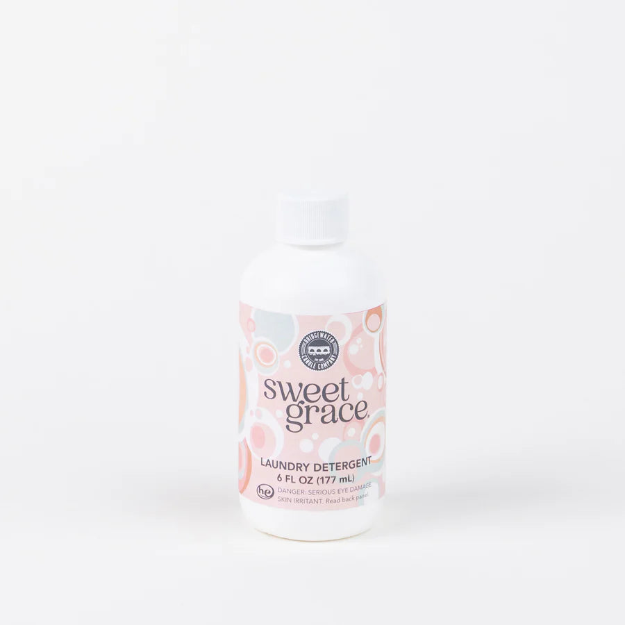 bottle of sweet grace laundry detergent displayed against white background
