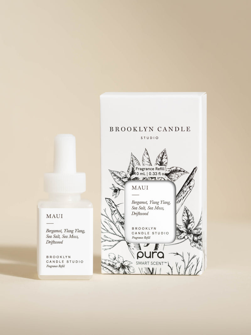 Pura Scents Maui Smart Vial by Brooklyn Candle Studio set next to its box packaging on an off-white background.