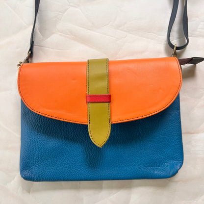 saddle bag with crossbody strap attached.