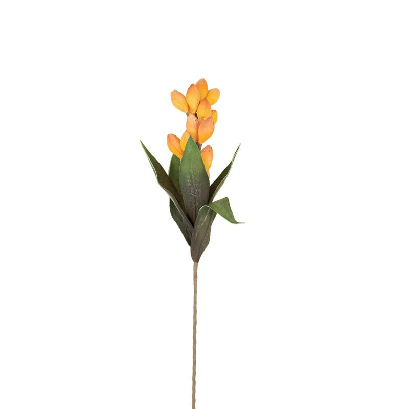 Artificial botanical stem with yellow pods and green leaves on a white background