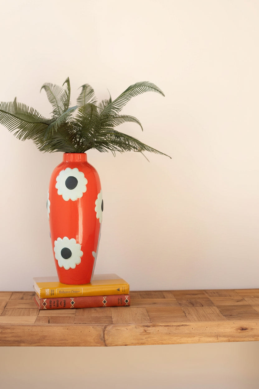 tall orange vase with pale green flower design