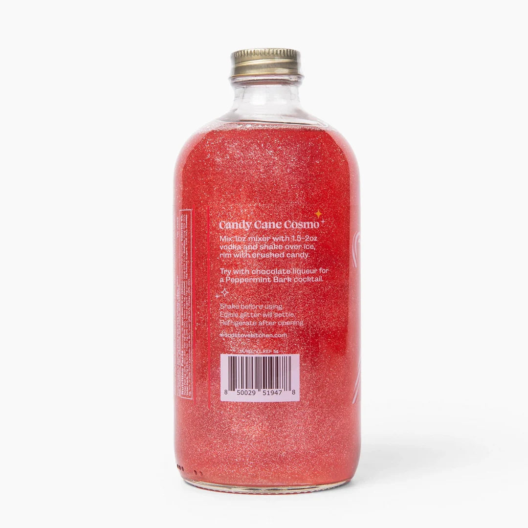 back view of Red bottle of Candy Cane Cosmo mixer with a gold cap on a white background