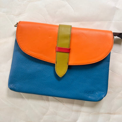 blue saddle bag with orange flap and lime tab.