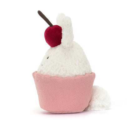 side view of Dainty Dessert Bunny Cupcake Plush Toy on a white background.