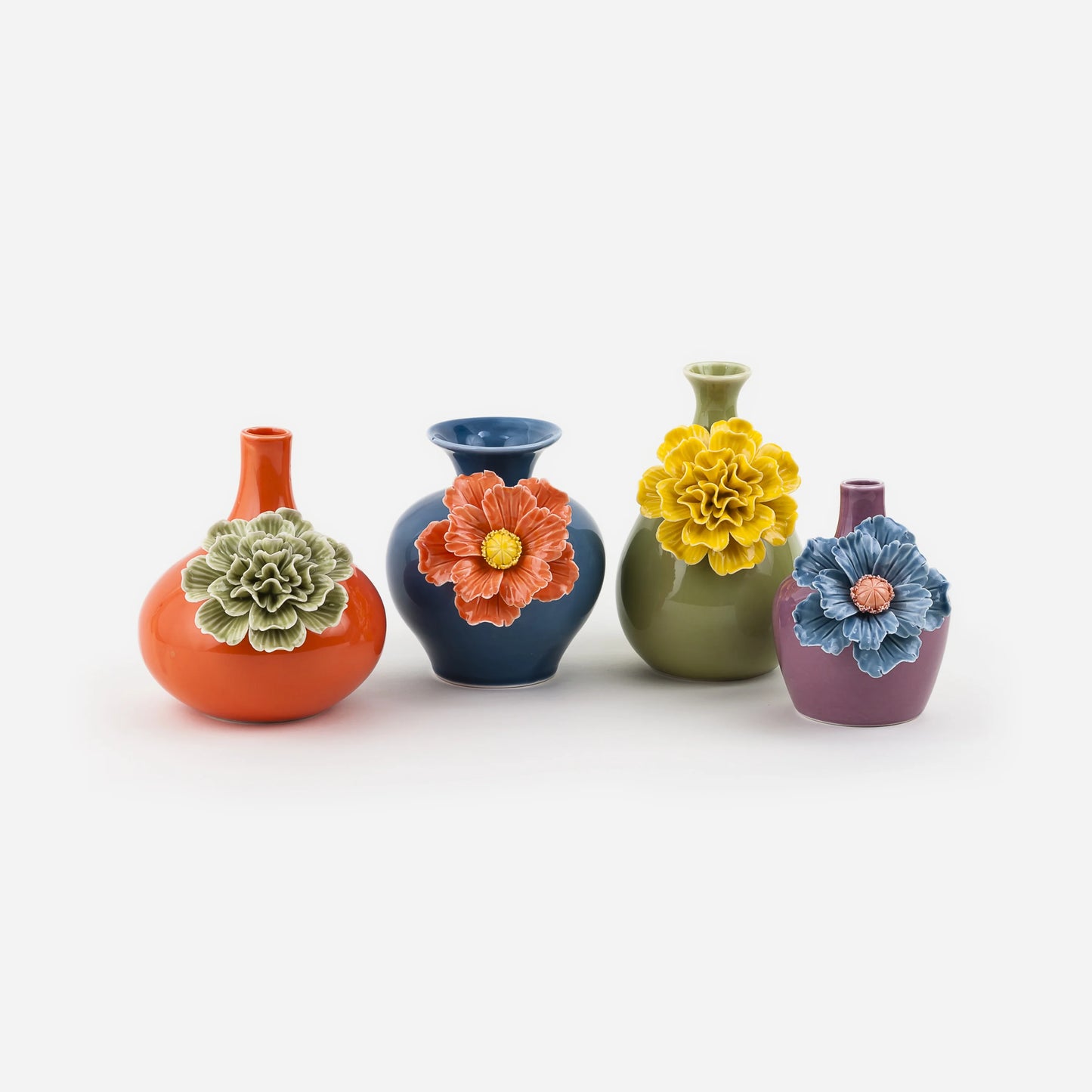 Four colorful vases with floral designs on a white background