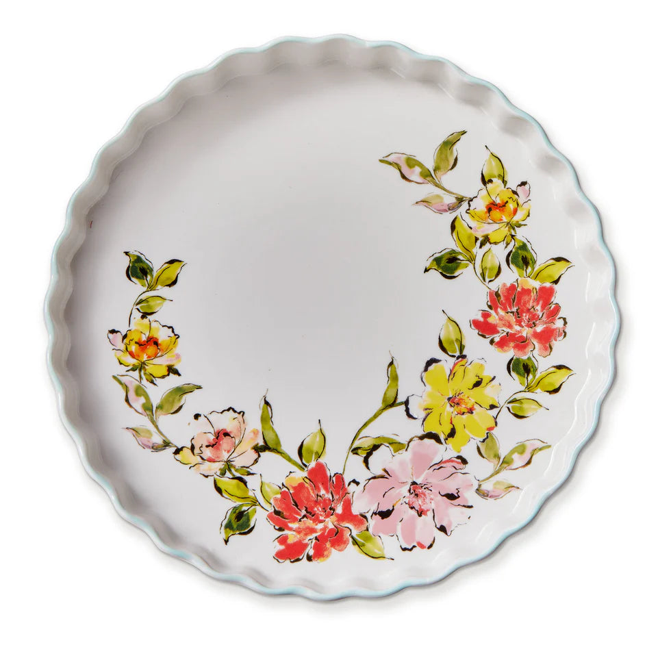 white tart dish with floral design in the bottom