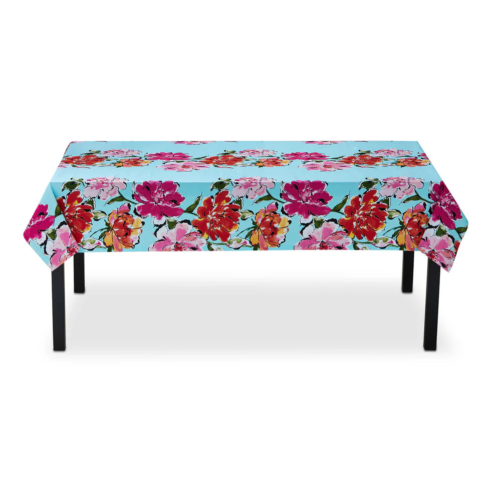 table with colorful floral cloth on it