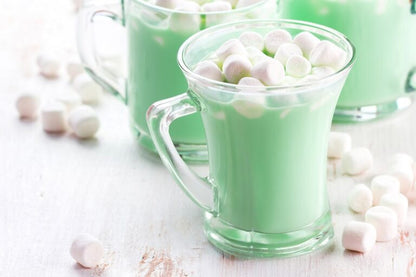 glass mug filled with elf hot chocolate and topped with marshmallows.