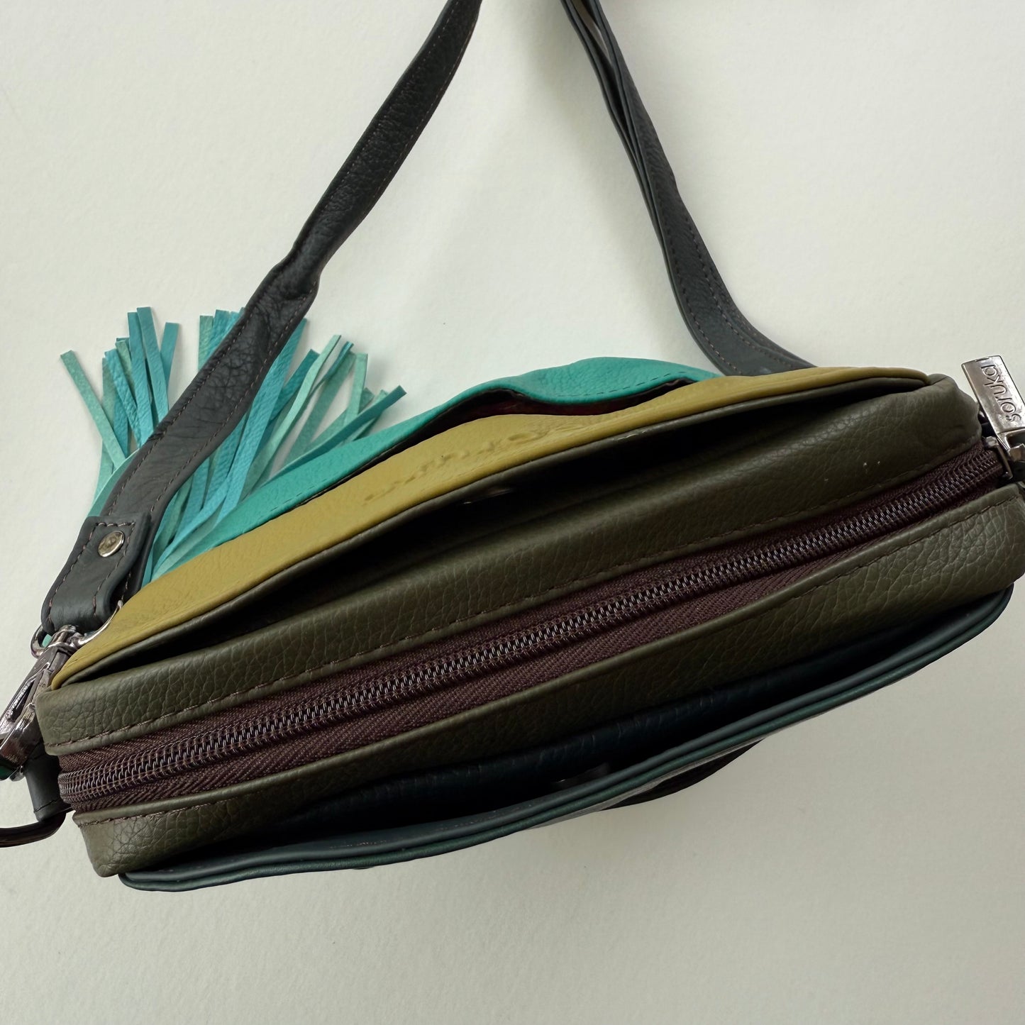 top view of handbag showing zipper and pockets