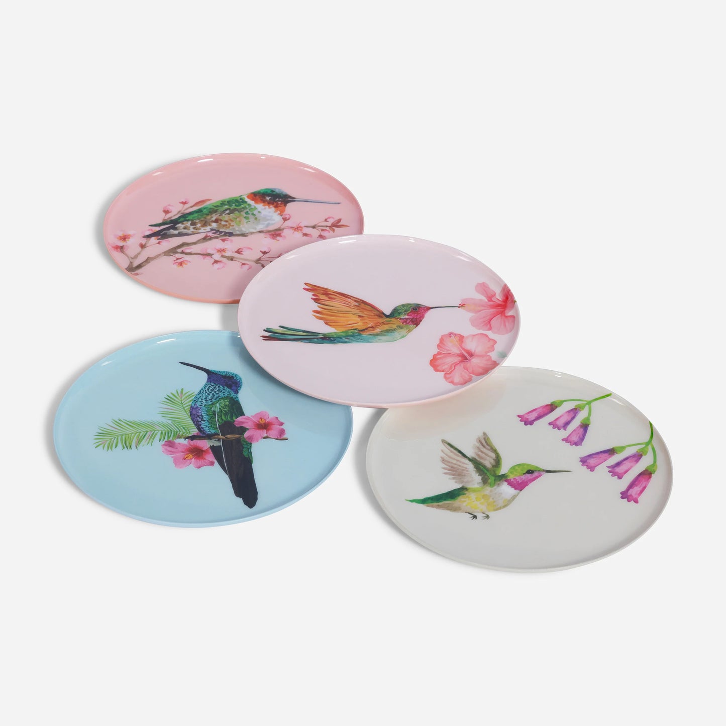 four round dishes with hummingbird and floral designs shown on a white background