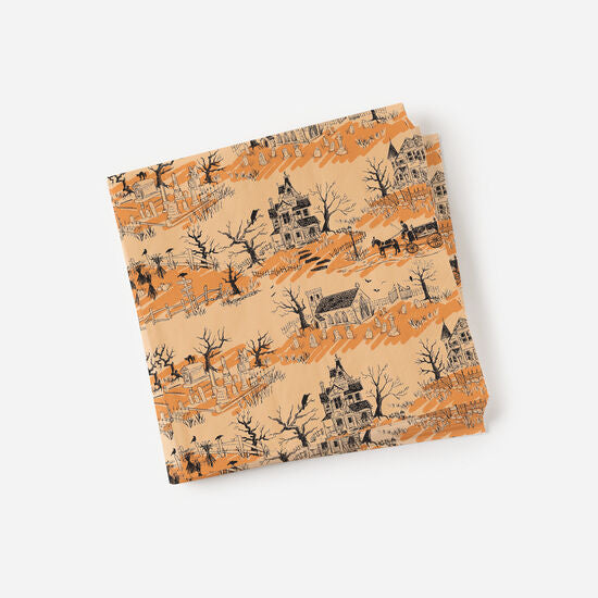 A paper napkin with a Halloween-themed toile pattern featuring autumnal colors and spooky imagery.
