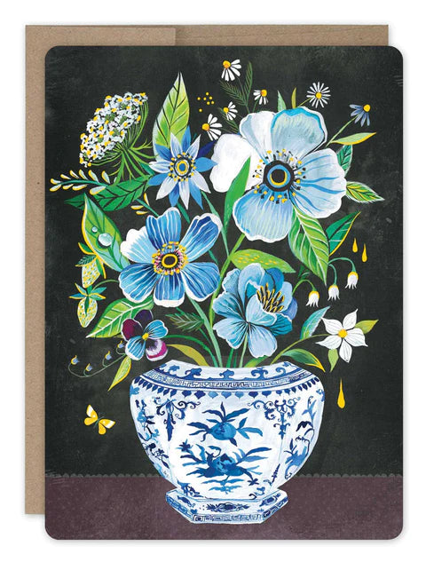 front of card is black with blue potted flowers, a natural envelope behind it and displayed on a white background