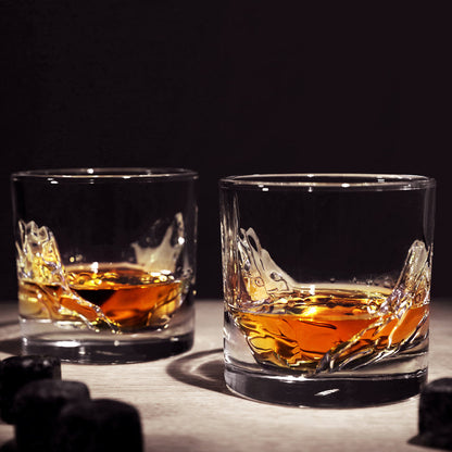 Grand Canyon Crystal Whiskey Glasses partially filled with whiskey set on a table.