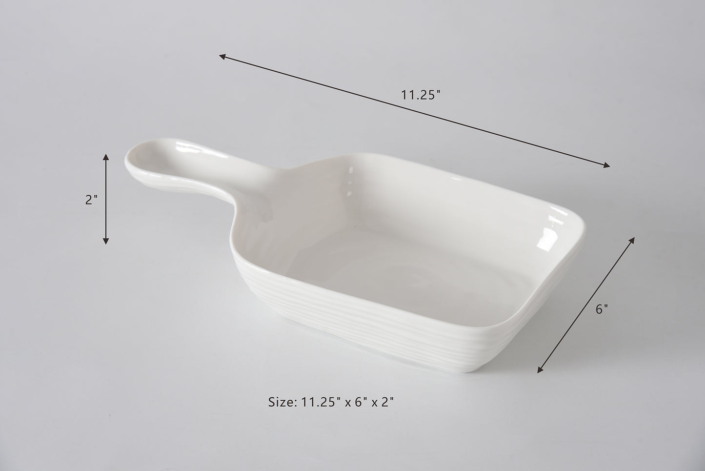 White ceramic dish with dimensions labeled on a gray background