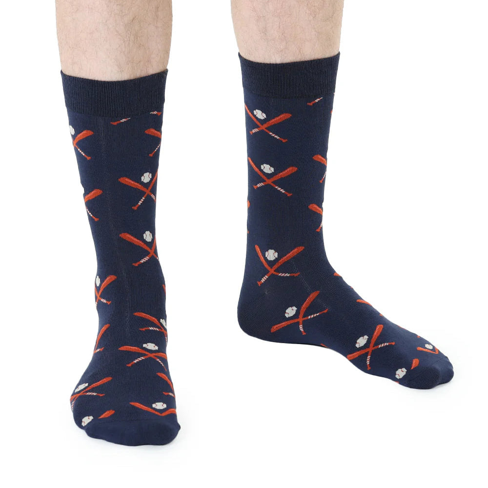 Navy socks with red and white baseball patterns worn by a person on a white background