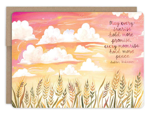 front of card has illustration of orange and pink hues in the setting sun sky and wheat at the bottom, dark pink text listed in the description, natural envelope behind it and displayed on a white background