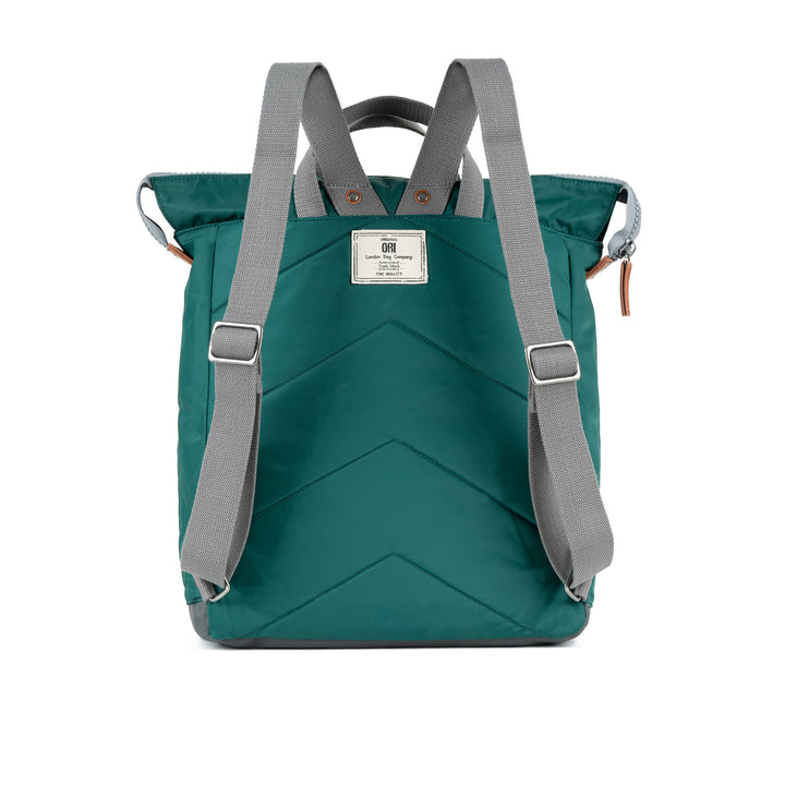 back view of teal bantry b backpack showing shoulder straps.