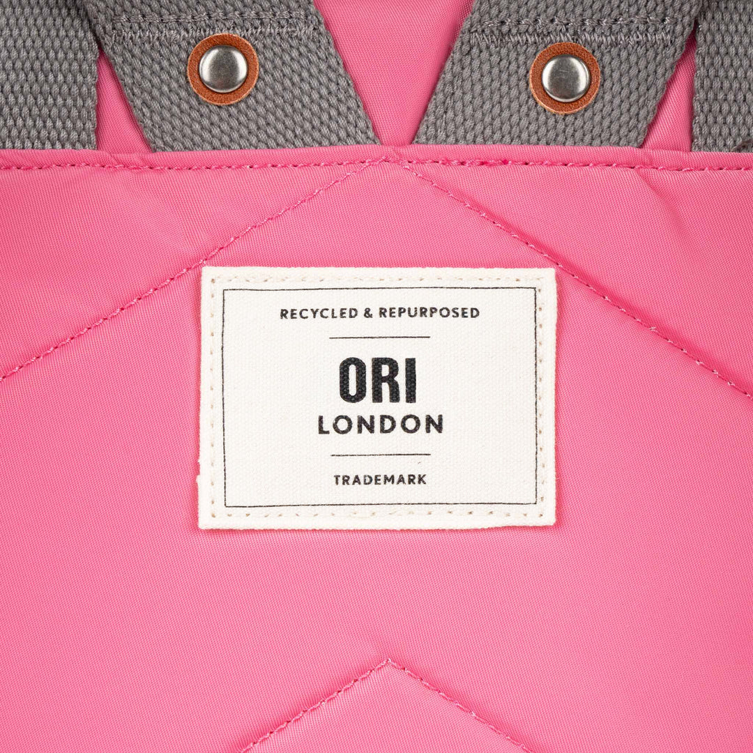 close-up of Baroque canfield b backpack's ori logo tag.