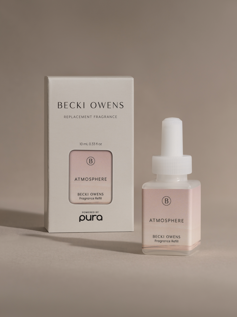 Pura Scents Atmosphere Smart Vial by Becky Owens set next to its box packaging.