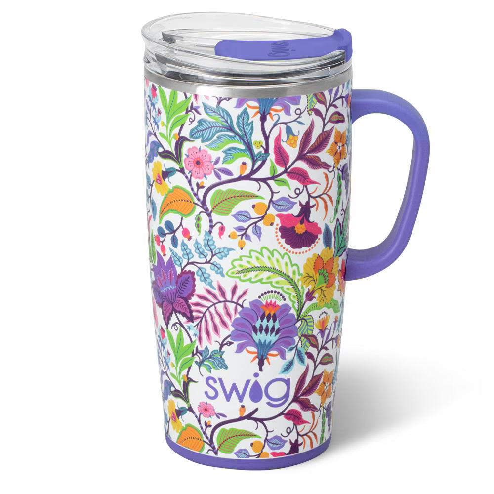 white tumbler with blue handle and all-over colorful floral design