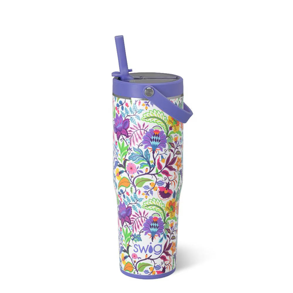 white tumbler with blue straw and top handle and all-over colorful floral design