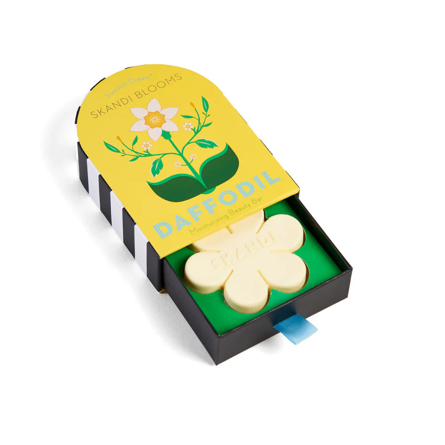 yellow box packaging slightly open showing flower shaped soap inside