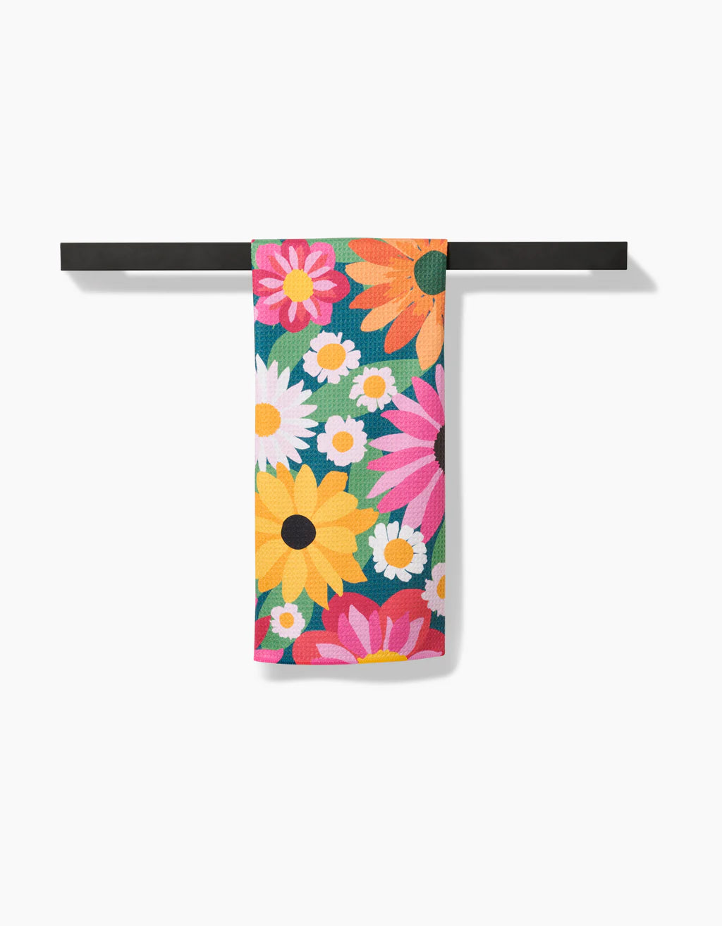 Wild Blooms Tea Towel draped over a rod