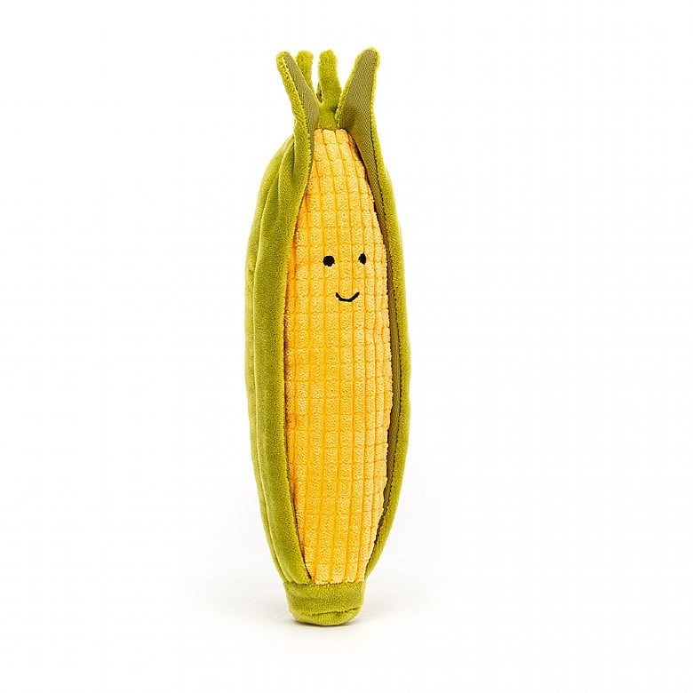 plush corn on the cob with husk and smile face on white background