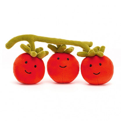 3 plush tomatoes with smile faces on a plush vine on a white background 