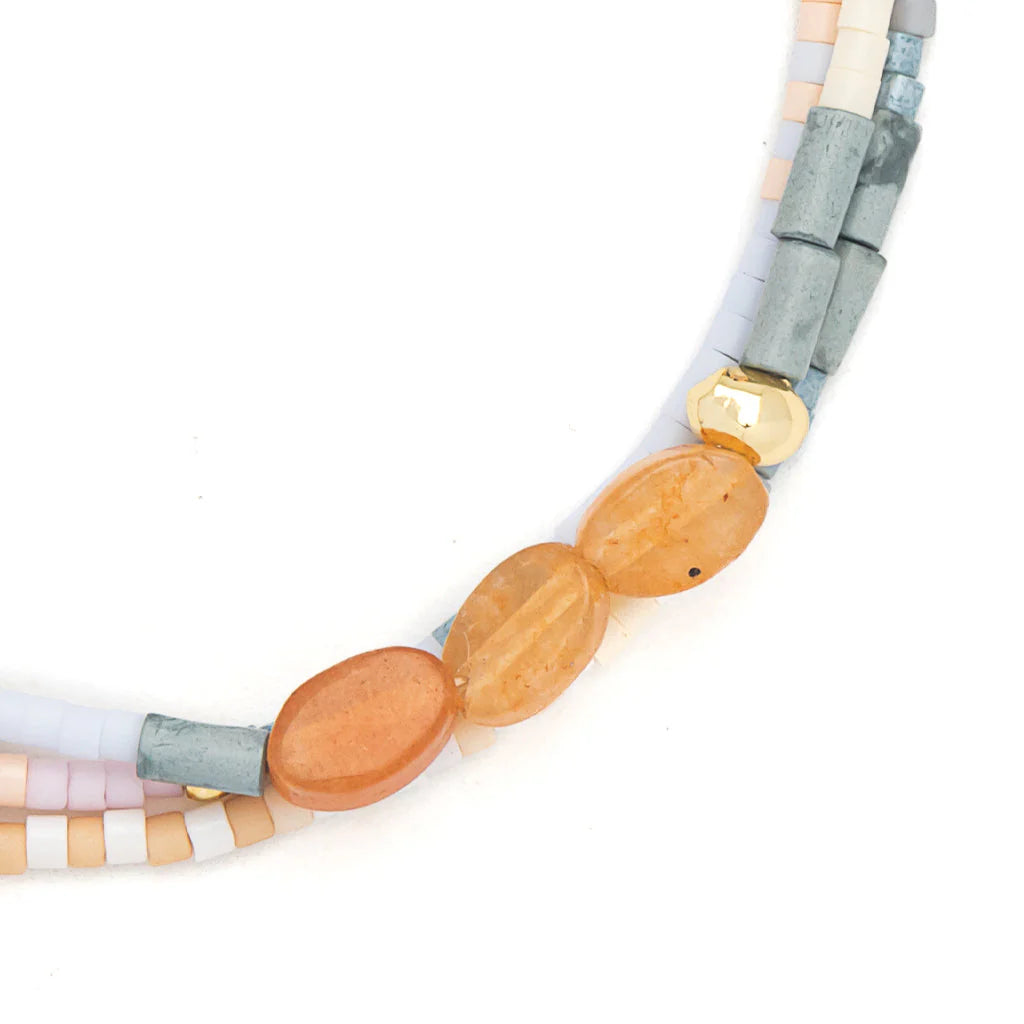 close-up of beaded bracelet on a white background