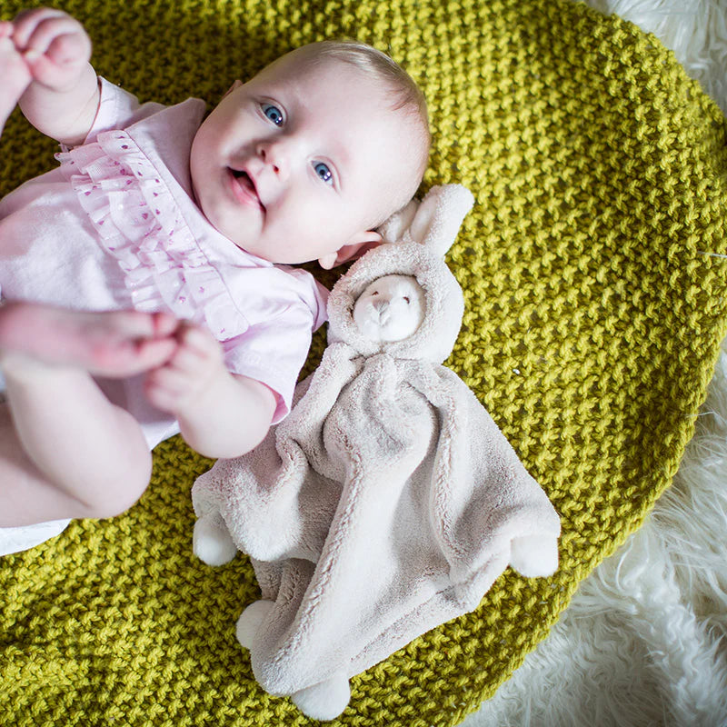 baby laying with Ziggy Bear Tan Blankie
