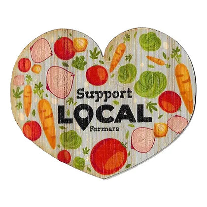heart shaped sticker filled with different images of vegetables with text in the center "support local farmers" 