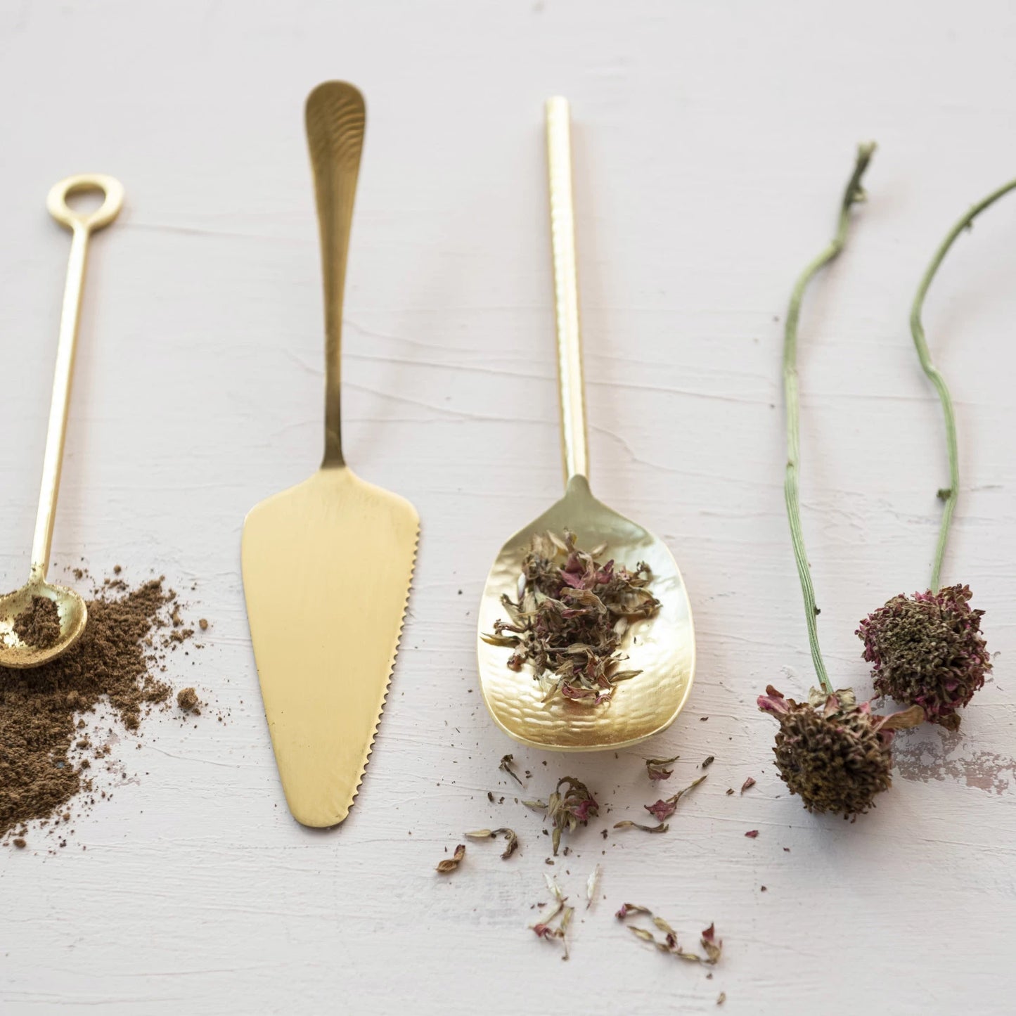 Gold Electroplated Cake Server arranged with other serving utensils
