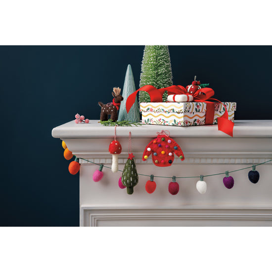 felt christmas lights garland draped on a mantle
