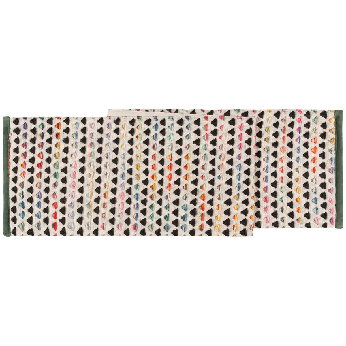 A multicolored geometric patterned table runner laid out on a white surface.
