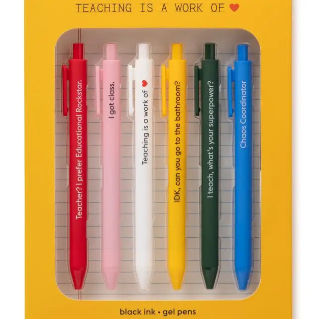 Set of six colorful pens in packaging with humorous text on a yellow background
