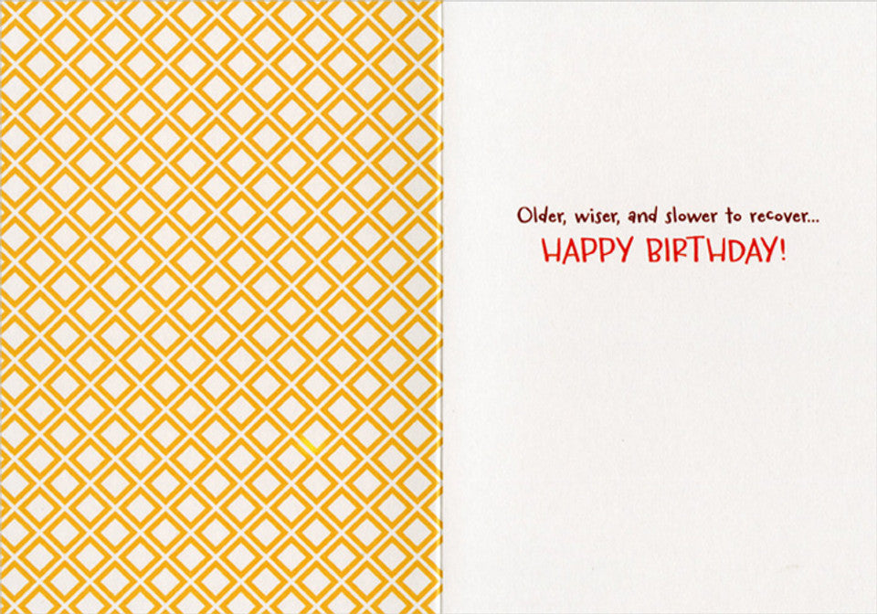 inside of card with left side printed with yellow geometer pattern and right side with text.