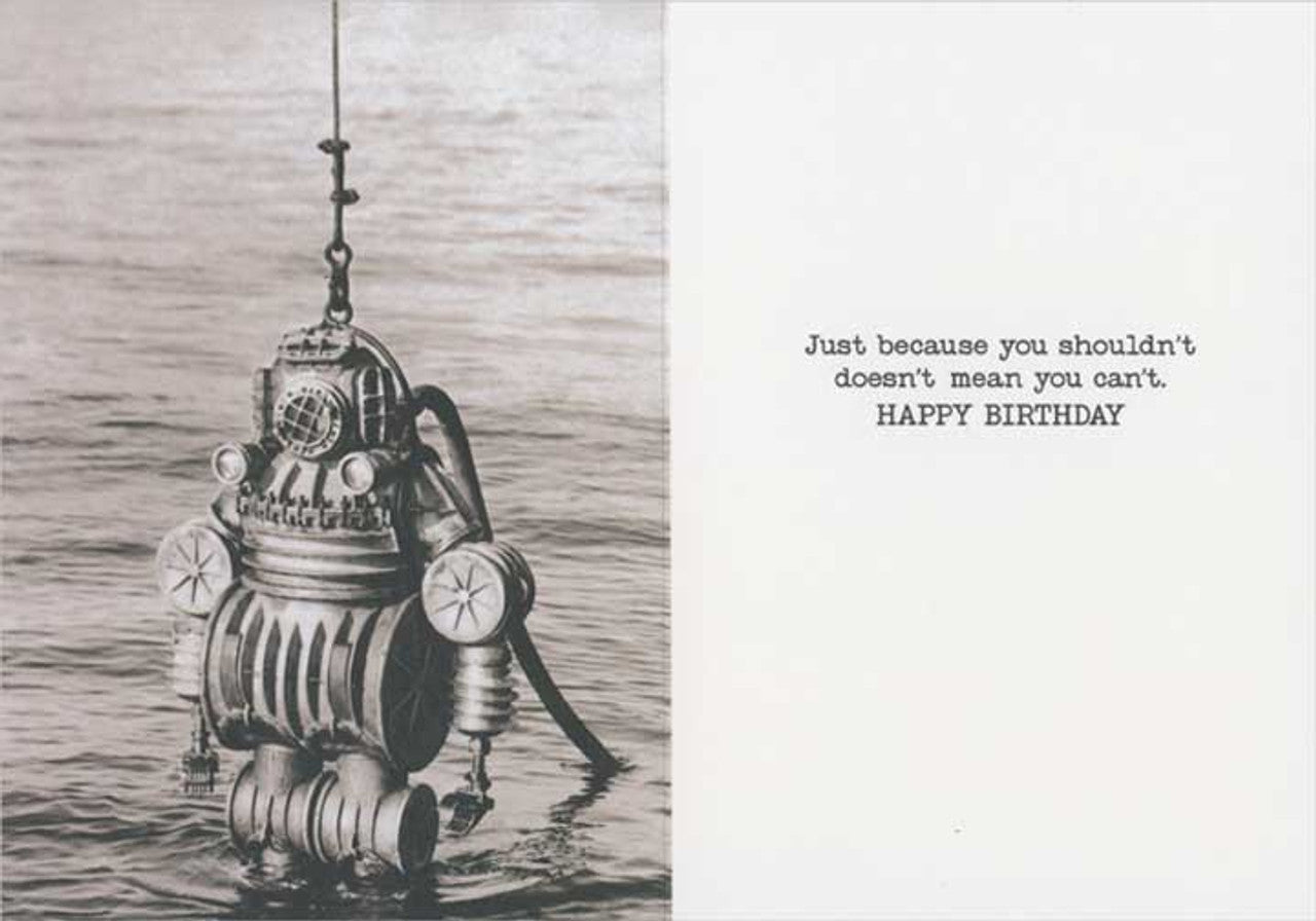 inside of card with text and image on person in metal diving suit in the water.
