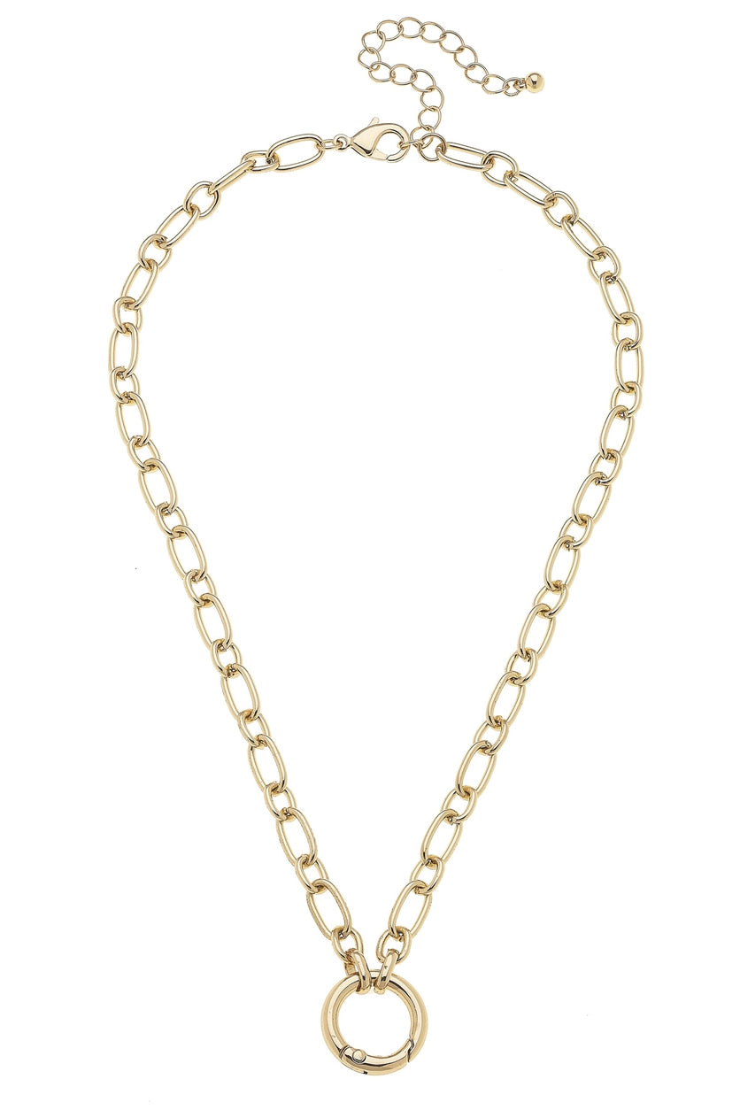 Gold chain necklace with carabiner clasp in the front shown on a white background
